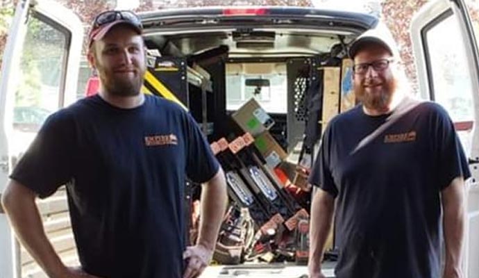 Empire Overhead Doors professional team with service van