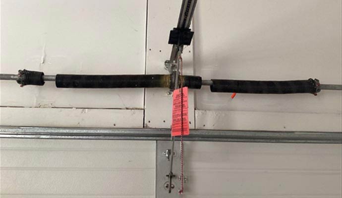 Broken garage door spring system