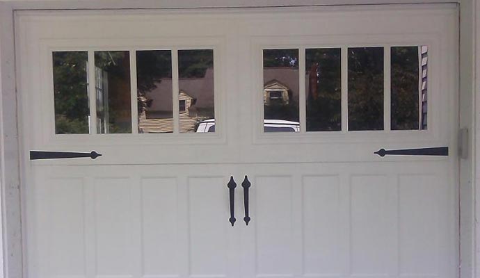 Carriage house with a double garage door