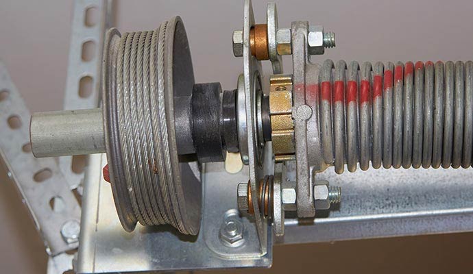 Close-up view of garage door cable drum