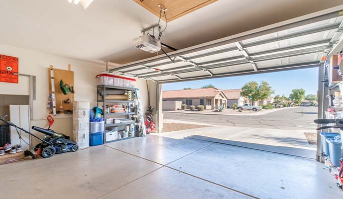 Automatic garage door opener mounted inside an open garage
