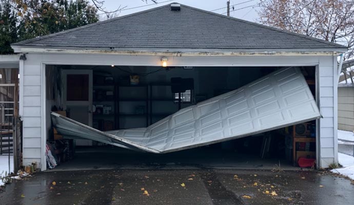 A white detached and collapsed  garage door