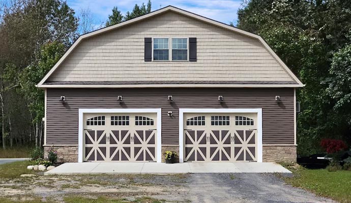 A large two-story gambrel-style garage