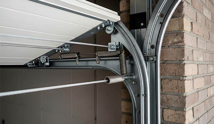 Garage door track with proper alignment after repair