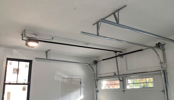 Garage door vertical tracking system