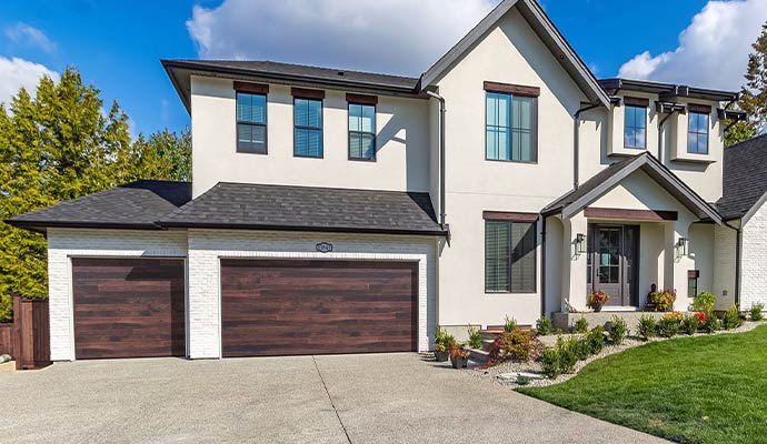 Home with Haas garage doors on driveway