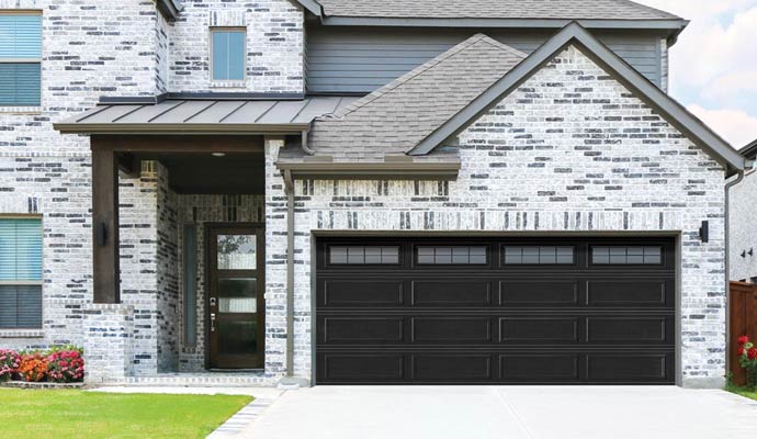 Black garage door from Wayne Dalton with windows on brick house