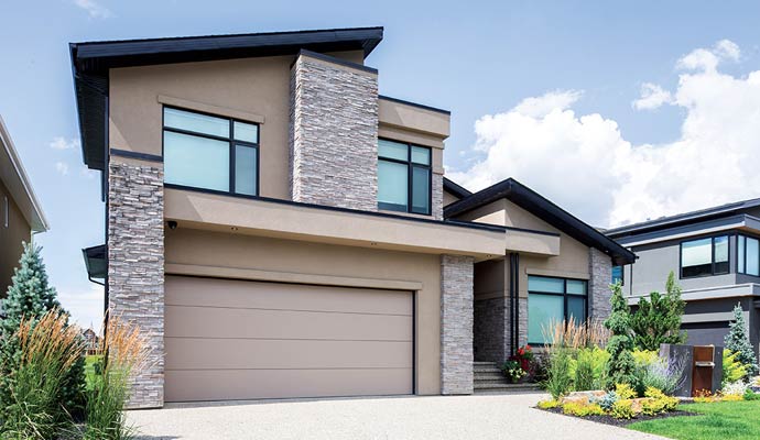 Modern home featuring a stylish Wayne Dalton garage door
