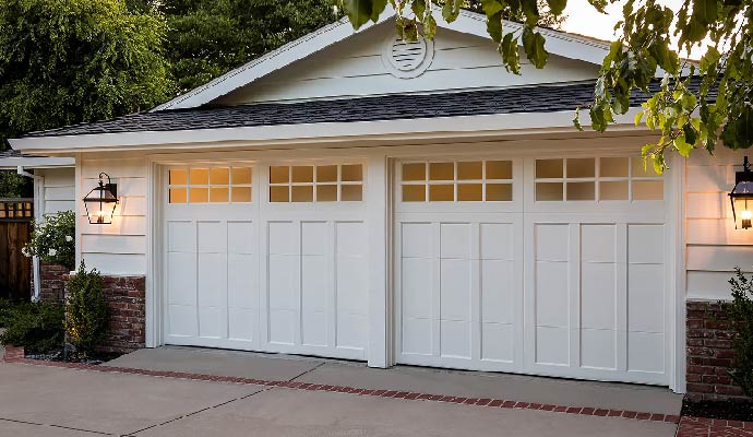 White Clopay garage doors with illuminated top window